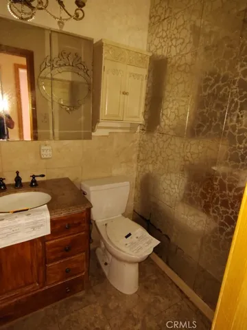 a bathroom with a toilet and a sink