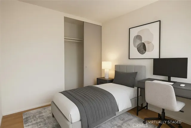 a bedroom with a bed and chair