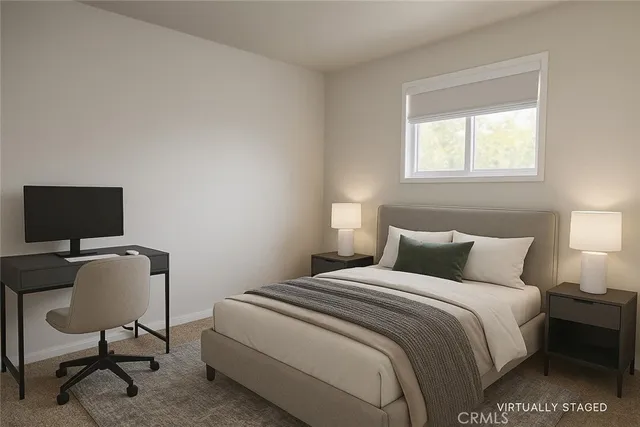 a bedroom with a bed chair and a window