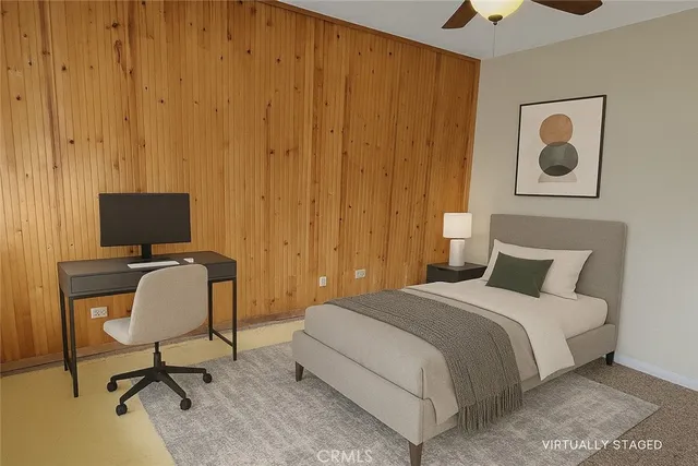 a bedroom with a bed and a chair