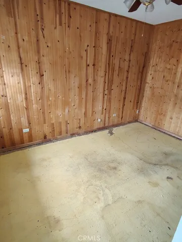a view of wooden floor and a window