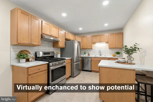 a kitchen with granite countertop a sink stainless steel appliances wooden floor and cabinets