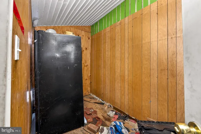 a bathroom with a shower curtain and a window