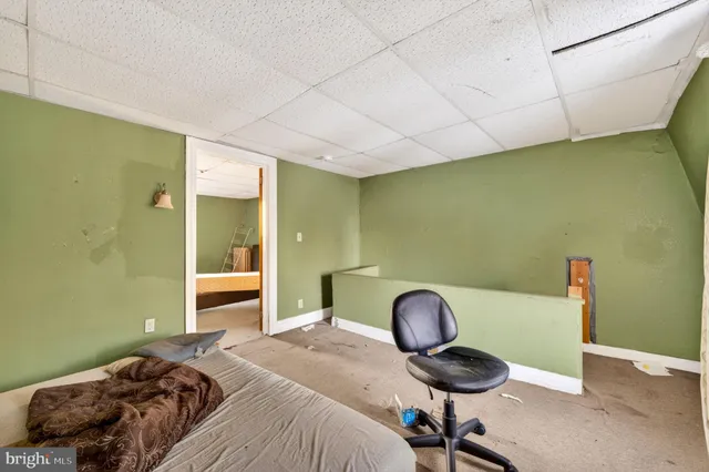 a bedroom with a bed and cabinets