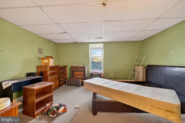 a bedroom with furniture and a bed