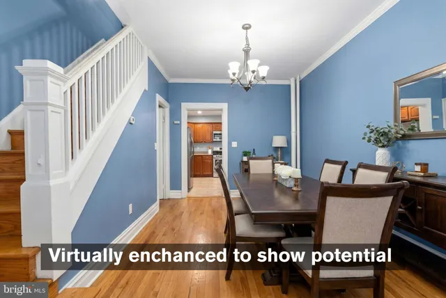a view of a dining room with furniture wooden floor and chandelier