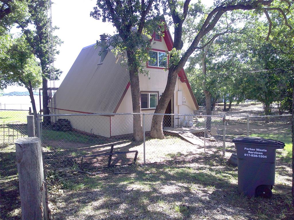 999 Roberts Cut Off Road Bowie, TX 76230 - Photo 2 of 17 a view of a house with a yard