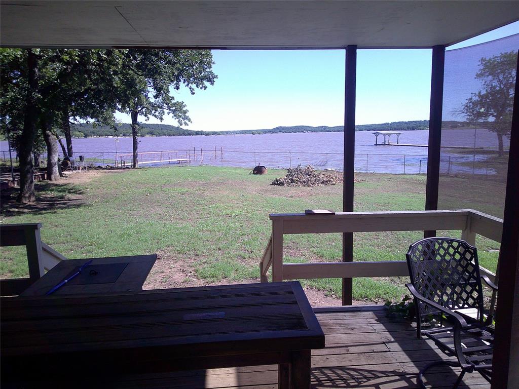 999 Roberts Cut Off Road Bowie, TX 76230 - Photo 5 of 17 a view of a bench in the backyard