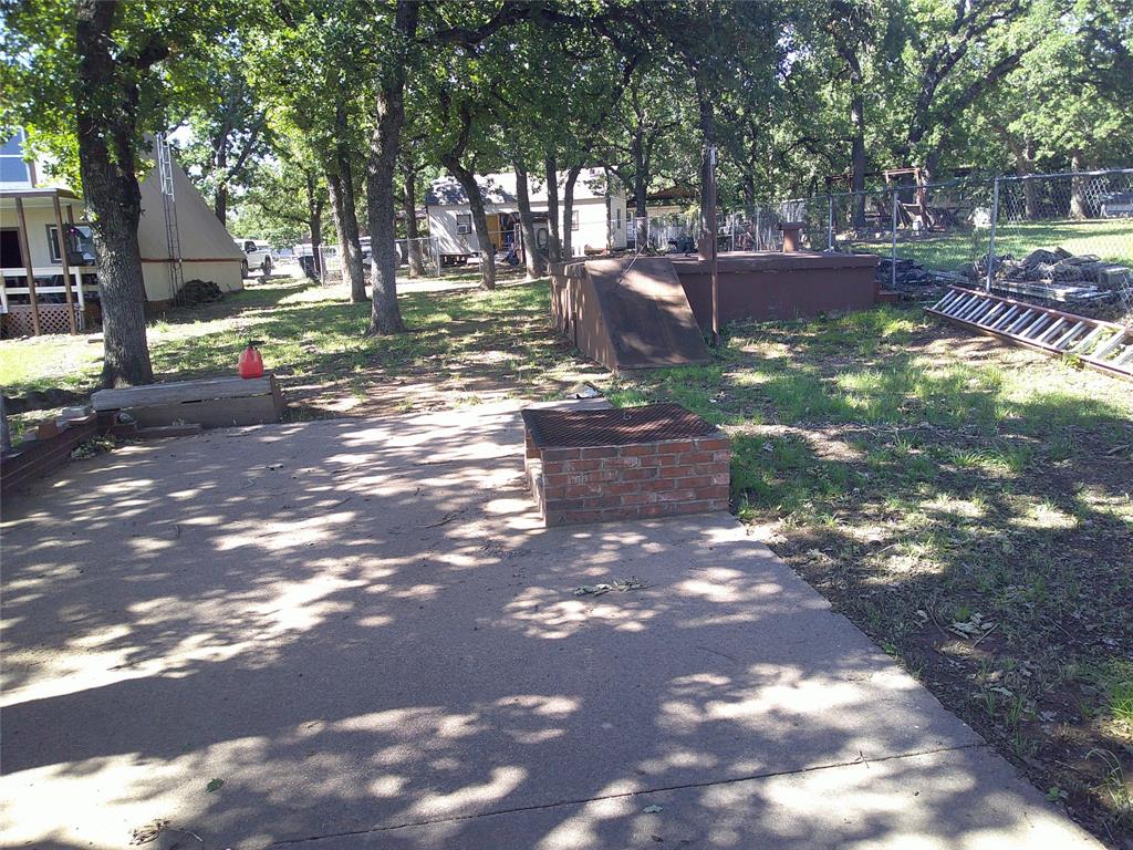 999 Roberts Cut Off Road Bowie, TX 76230 - Photo 9 of 17 a view of a street with houses on both side