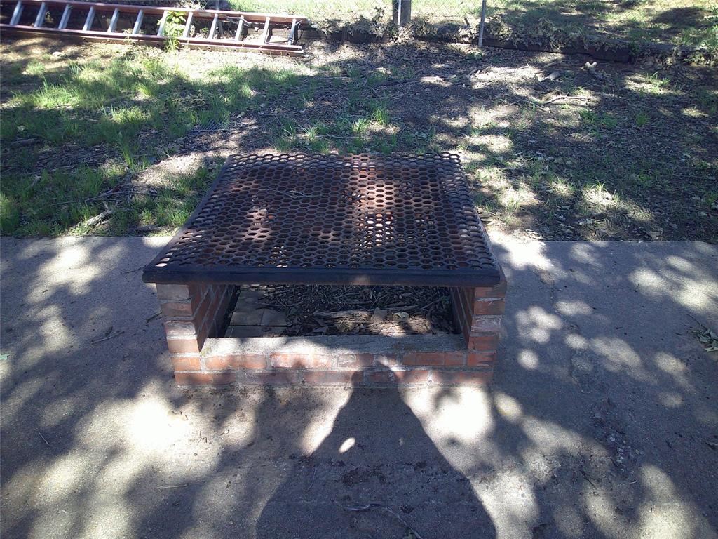 999 Roberts Cut Off Road Bowie, TX 76230 - Photo 10 of 17 a view of a house with a yard
