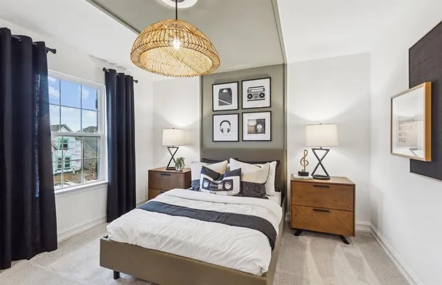 a bedroom with a bed and a mirror