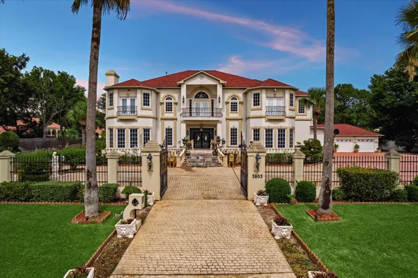 a view of multiple houses with a yard