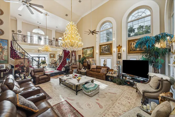 a view of a livingroom with furniture and a flat screen tv