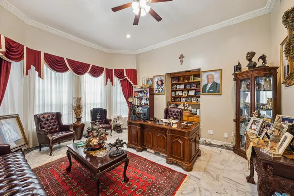 a living room with furniture a couch and a chandelier