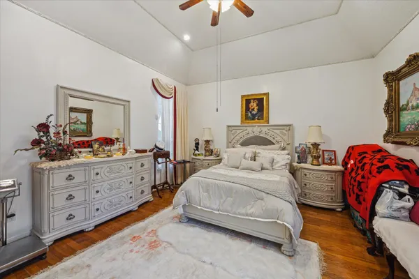 a bedroom with two beds and a chandelier