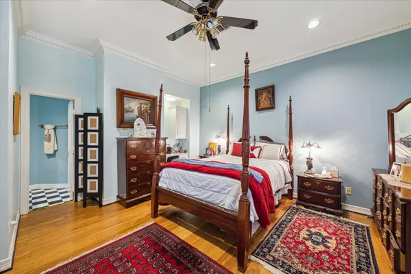 a bed room with a bed and a chandelier