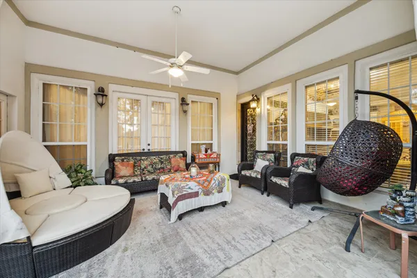 a living room with furniture and a large window