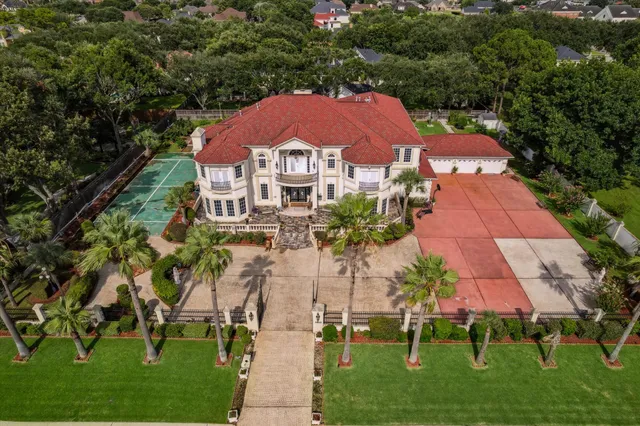 an aerial view of a house with a garden