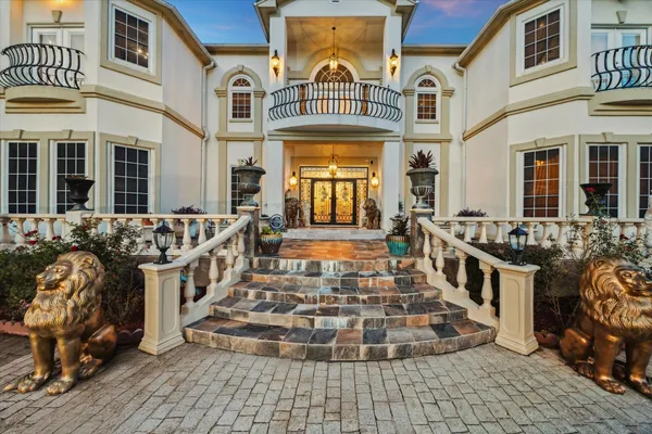 a front view of a house with many windows