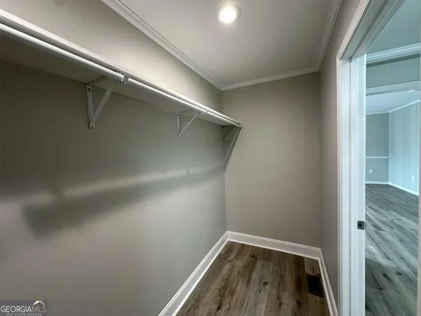 a view of an empty walk in closet