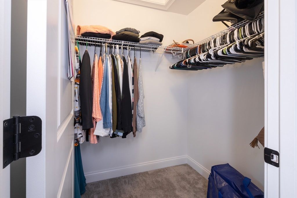 194 A Narrows Road Westminster, MA 01473 - Photo 22 of 31 a view of walk in closet with clothes and shoes