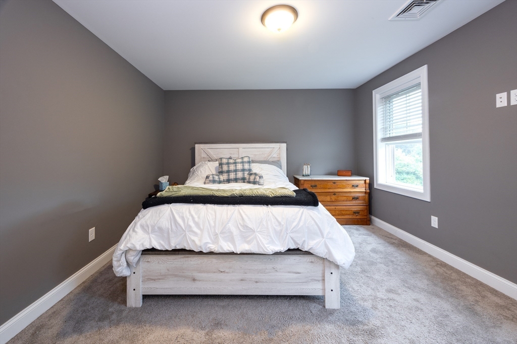 194 A Narrows Road Westminster, MA 01473 - Photo 23 of 31 a bedroom with a bed and window