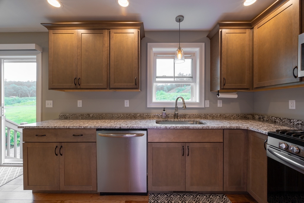 194 A Narrows Road Westminster, MA 01473 - Photo 10 of 31 a kitchen with stainless steel appliances granite countertop a stove a sink and a microwave