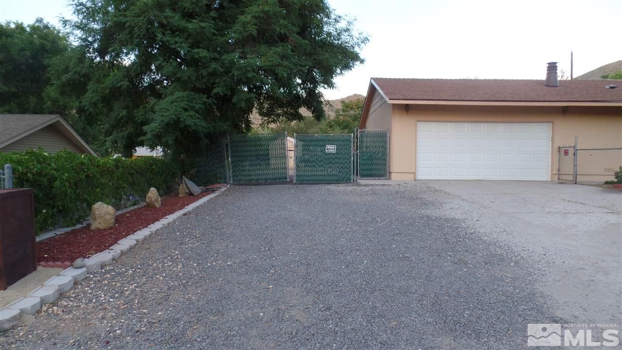 8900 Turbine Way Reno, NV 89506 - Photo 5 of 19 a view of a house with a garage