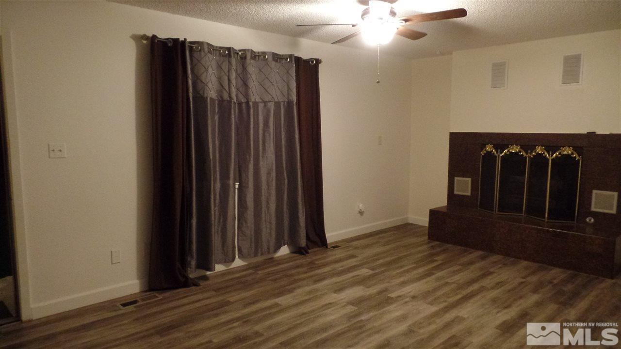8900 Turbine Way Reno, NV 89506 - Photo 7 of 19 wooden floor in an empty room