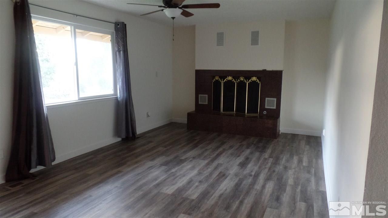 8900 Turbine Way Reno, NV 89506 - Photo 8 of 19 a view of a room with wooden floor and a window