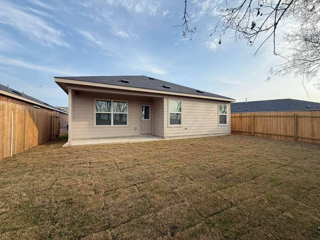 545 Sormonne Loop Kyle, TX 78640 - Photo 6 of 39 Back of house featuring a patio and a fenced backyard