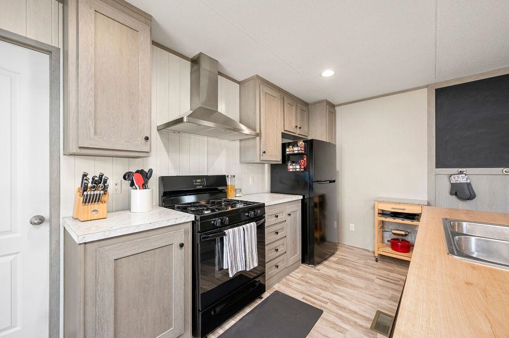 271 Clements Way Fruita, CO 81521 - Photo 8 of 26 a kitchen with stainless steel appliances granite countertop a sink stove and refrigerator