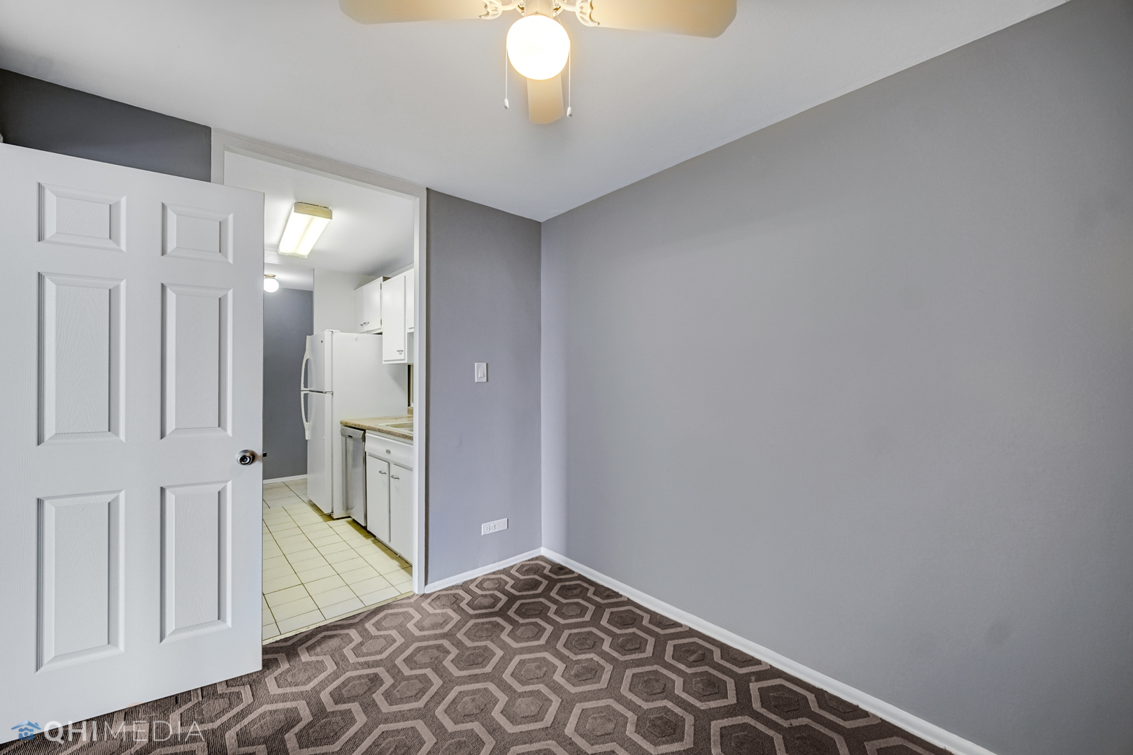 5740 North Sheridan Road, Unit 12C Chicago, IL 60660 - Photo 18 of 19 a view of a hallway with entryway wooden floor and cabinet