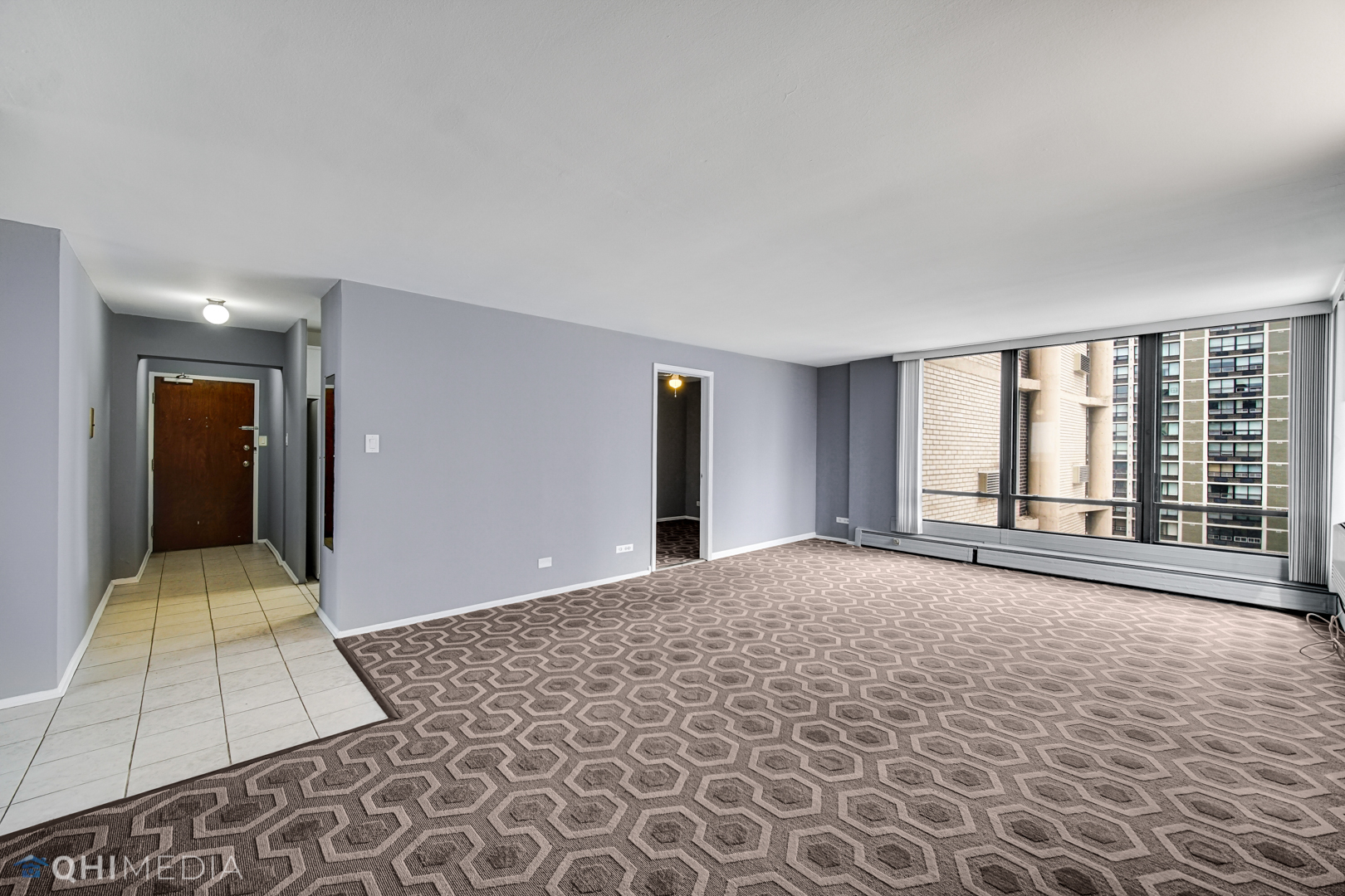 5740 North Sheridan Road, Unit 12C Chicago, IL 60660 - Photo 5 of 19 a view of a room with a large window