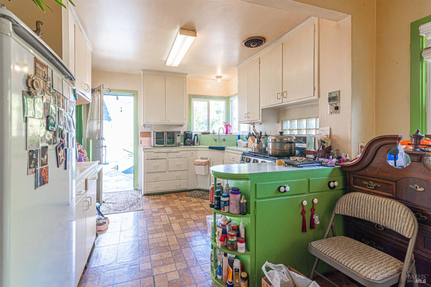 1818 4th Street Santa Rosa, CA 95404 - Photo 16 of 39 a kitchen with sink refrigerator and window