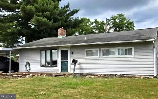60 Gamewood Road Levittown, PA 19057 - Photo 1 of 10 a front view of a house with a garden