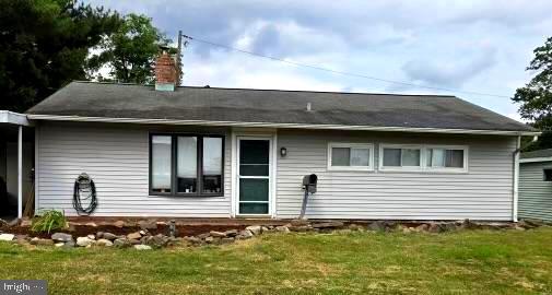 60 Gamewood Road Levittown, PA 19057 - Photo 2 of 10 a front view of a house with a garden
