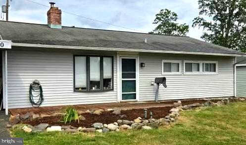 60 Gamewood Road Levittown, PA 19057 - Photo 3 of 10 a front view of a house with garden