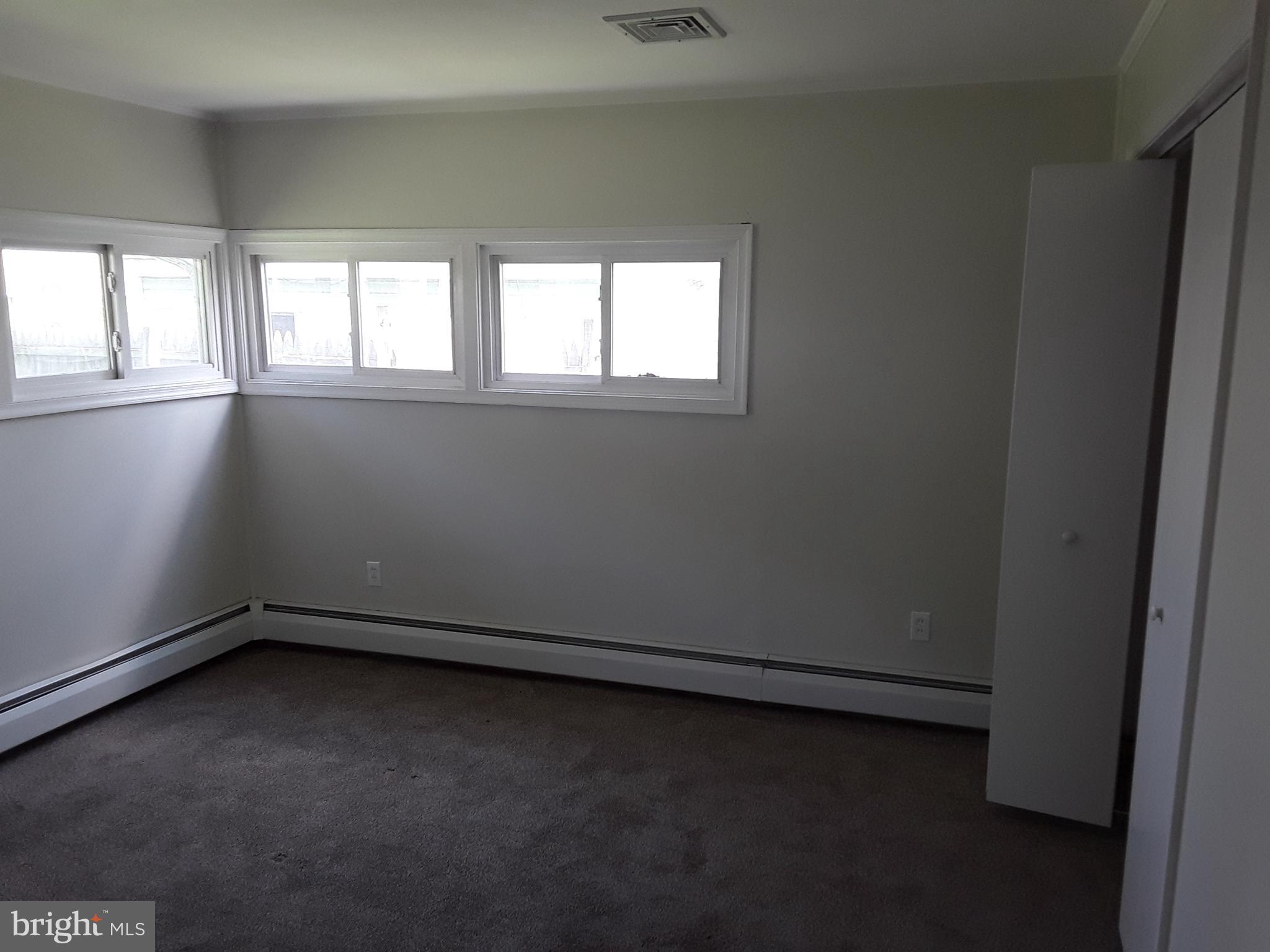 60 Gamewood Road Levittown, PA 19057 - Photo 7 of 10 an empty room with a window