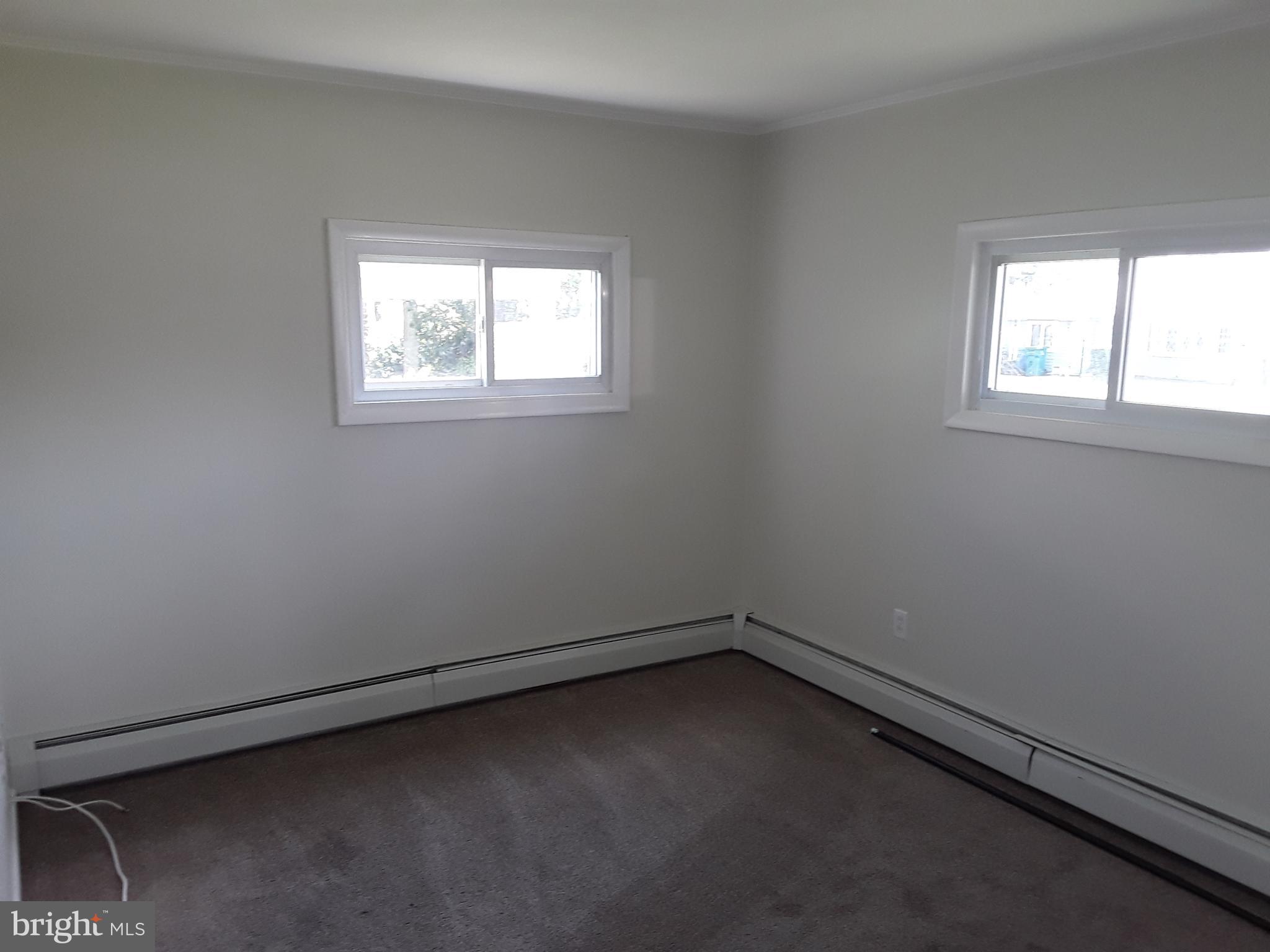 60 Gamewood Road Levittown, PA 19057 - Photo 8 of 10 an empty room with a window