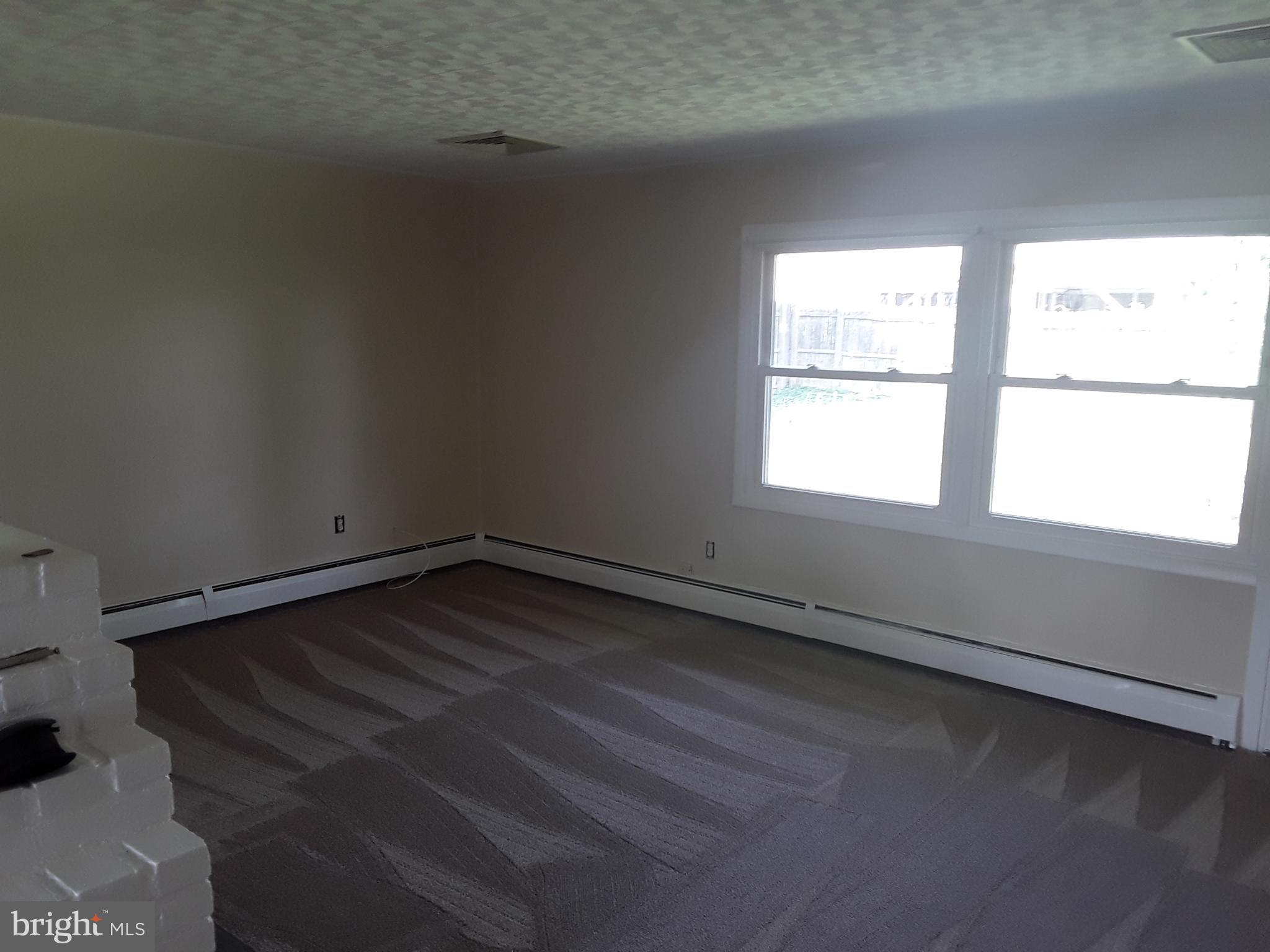 60 Gamewood Road Levittown, PA 19057 - Photo 9 of 10 a view of a room with wooden floor and windows