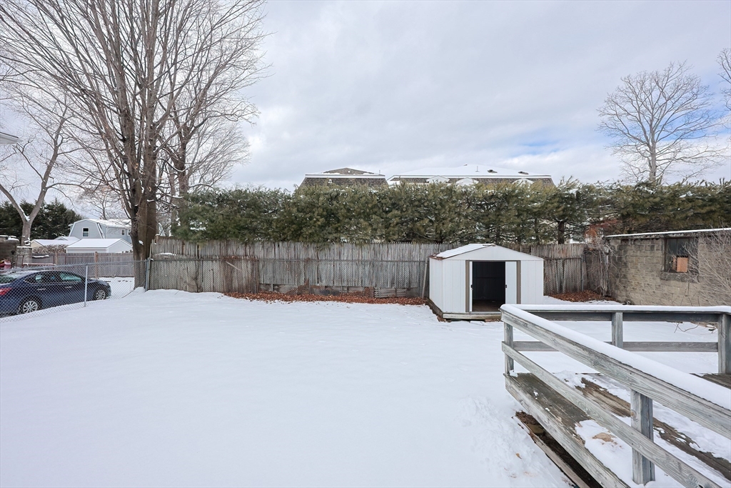 17 Kilburn Road Newton, MA 02465 - Photo 3 of 24 a view of a terrace with a barbeque and large trees