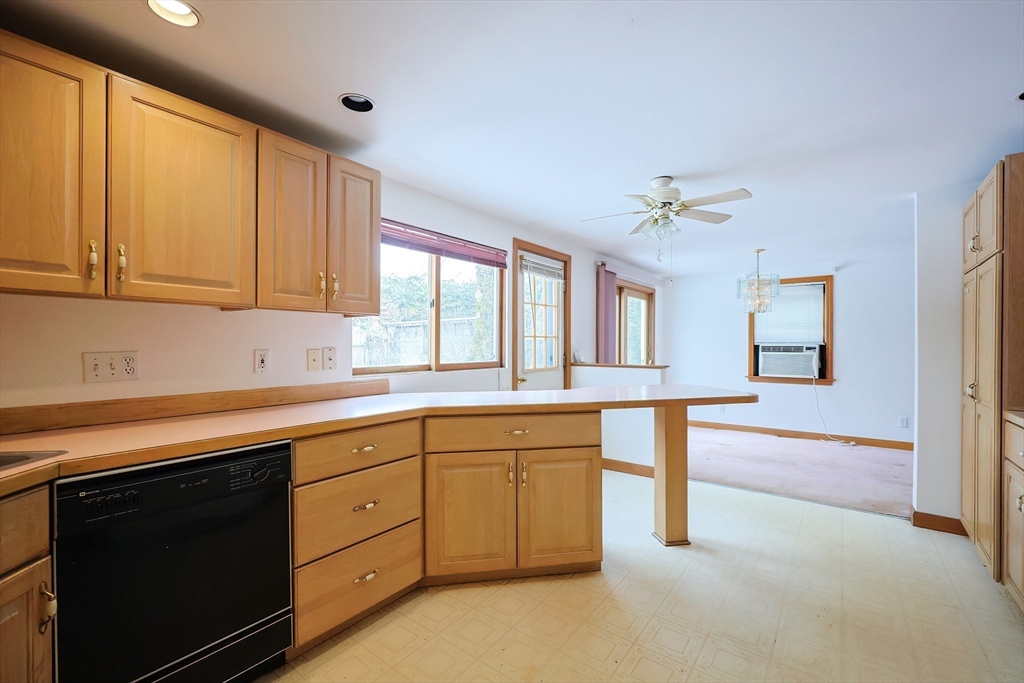 17 Kilburn Road Newton, MA 02465 - Photo 10 of 24 a kitchen with granite countertop white cabinets and white appliances