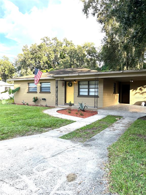 2708 Dixie Road Lakeland, FL 33801 - Photo 1 of 12 a front view of a house with garden