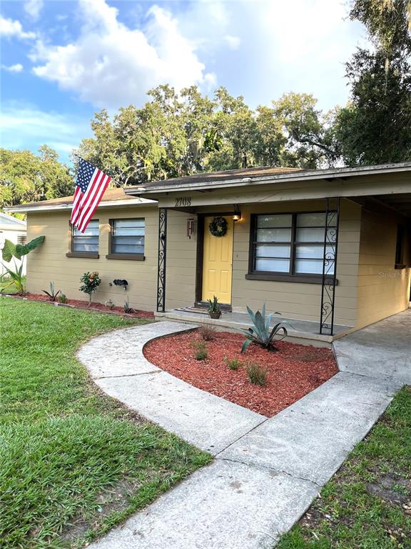 2708 Dixie Road Lakeland, FL 33801 - Photo 2 of 12 a front view of house with yard and seating area