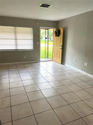 a view of empty room with windows