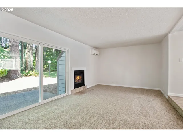 a view of an empty room with windows