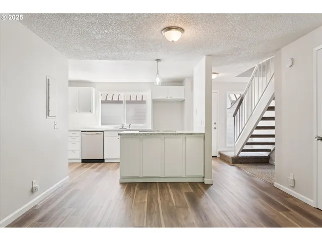 a view of kitchen with wooden floor