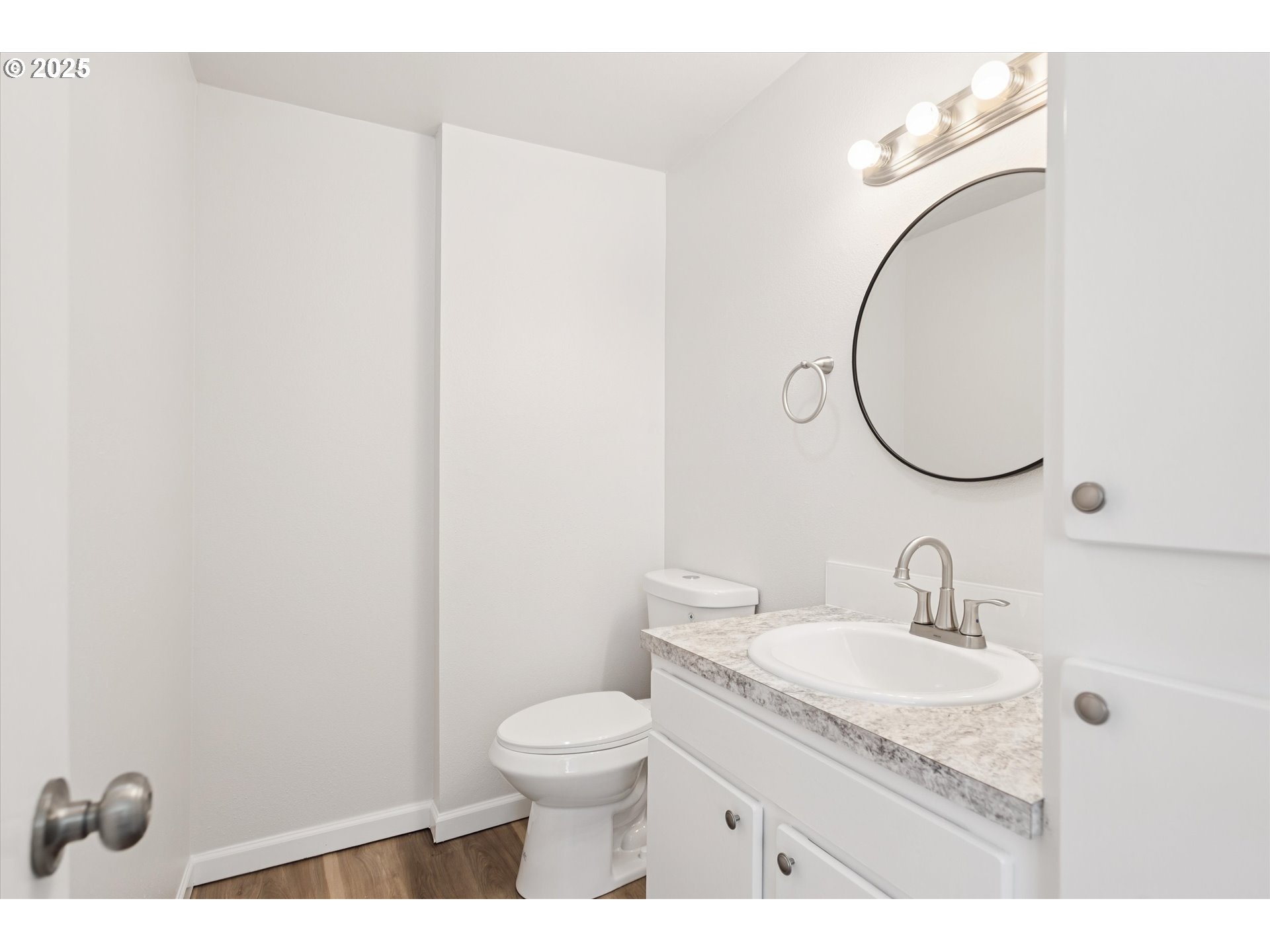 1200 Northeast Territorial Road, Unit 93 Canby, OR 97013 - Photo 18 of 36 a bathroom with a granite countertop sink toilet and a mirror
