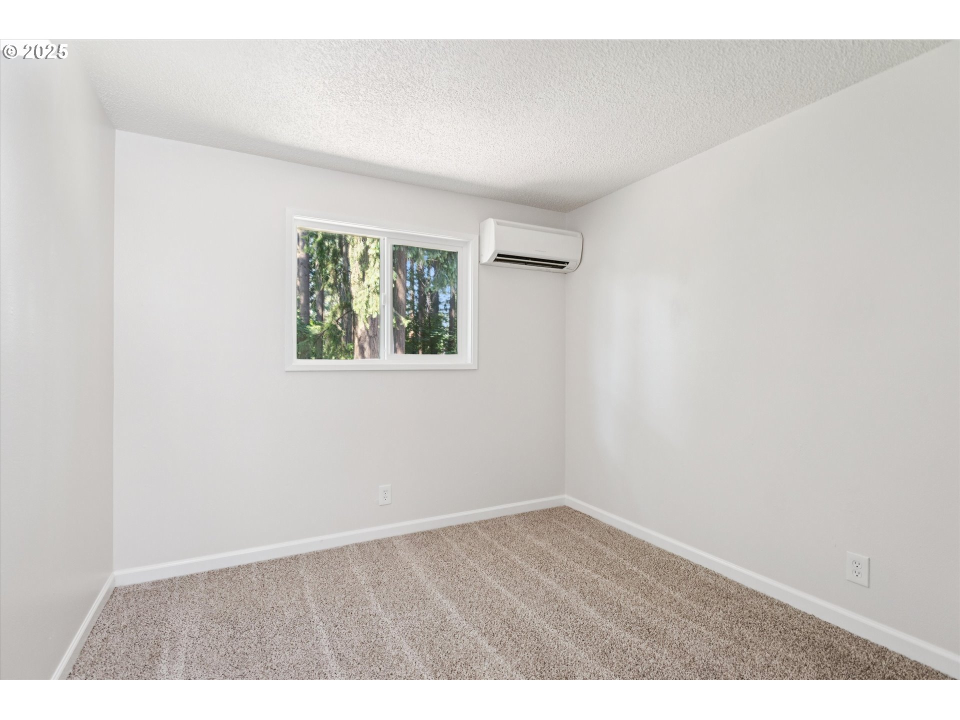 1200 Northeast Territorial Road, Unit 93 Canby, OR 97013 - Photo 23 of 36 an empty room with wooden floor and windows